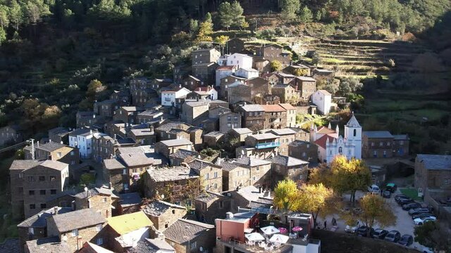 DRONE AERIAL FOOTAGE: The picturesque little schist villages of Piod&atilde;o clings to a steeply terraced mountainside deep within the foothills of the Serra de A&ccedil;or range in central Portugal. 