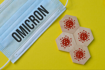 Wooden jigsaw puzzle with coronavirus variant. Omicron covid variant B.1.1. 529.
