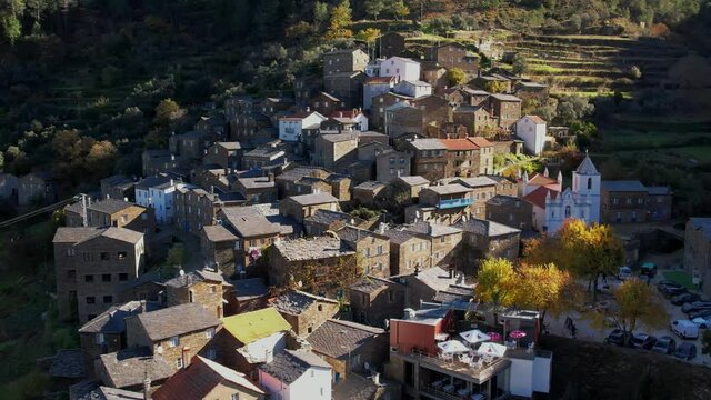 DRONE AERIAL FOOTAGE: The picturesque little schist villages of Piod&atilde;o clings to a steeply terraced mountainside deep within the foothills of the Serra de A&ccedil;or range in central Portugal. 