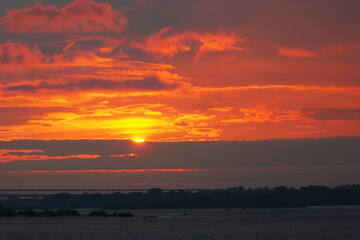  Sunset over the water with a glittering path.