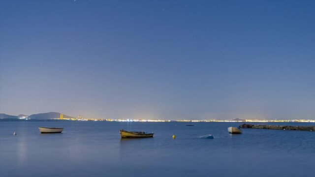 La Manga del Mar Menor, Murcia, Spain. Boats at night with stars - 4K Time-lapse