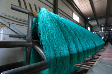 Nylon wire is on the mechanical device in a processing plant, North China - obrazy, fototapety, plakaty