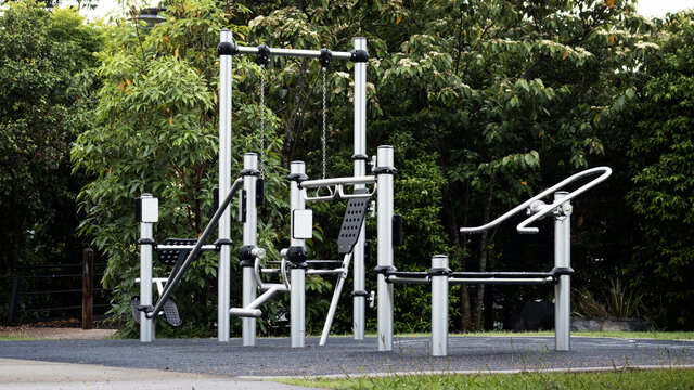 Outdoor Gym Equipment At The Park. Healthy Lifestyle.  Ideal For Weight Loss And Improving Overall Fitness. Public Park At Dawn After The Rain. 