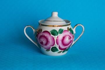 teapot and cup on a wooden table