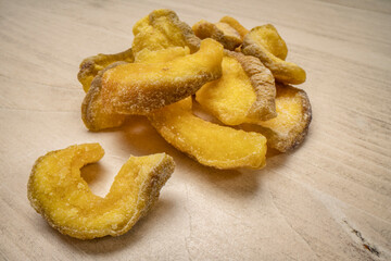 pile of dried guava fruit on wood table, delicious and healthy snack abundant in dietary fiber,...