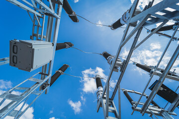 Construction of a power transmission substation on a background of blue sky