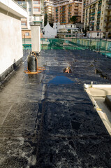 laying of waterproofing sheathing  and insulation during the renovation of a roof in Italy - 477009835