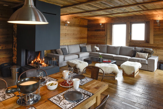 Warm chalet living room with a corner couch