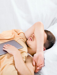 Obraz na płótnie Canvas Young Man sleep with a Tablet