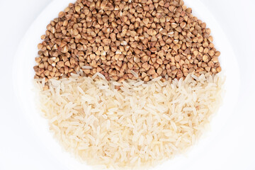Buckwheat rice in a plate. Close-up of rice. Close-up of buckwheat. Half rice and half buckwheat. Cereal culture. Proper nutrition