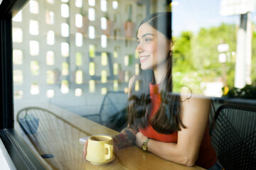 Young woman waiting for a friend at the cafe