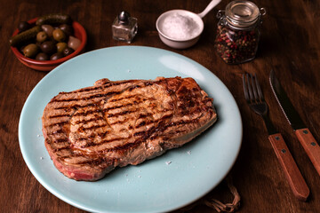 Grilled beef entrecote with flake salt, diner view.