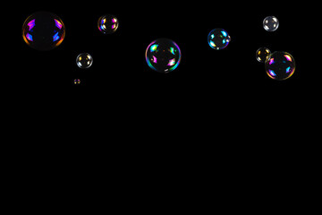 Soap bubbles isolated on a black background.