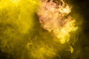 Yellow and pink steam on a black background.