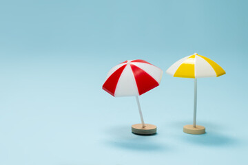 Yellow and red umbrella on a blue background.