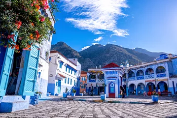 Foto op Plexiglas Marokko Public drinking water outlet between restaurant and traditional house at Chefchaouen, the blue city in the Morocco