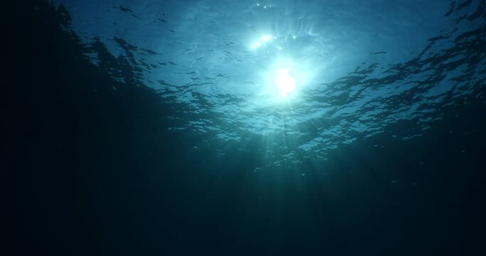 sun ray and sun beam scenery underwater waves on surface of water slow ocean scenery for backgrounds