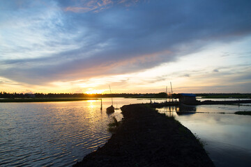 Obraz premium Beautiful sunset backwaters photography, Sunset beach Photography view from Kadamakudy Kerala, India, Seascape photography
