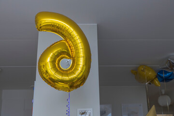 Close up view of balloon in form of number six on festive day of child. Sweden.