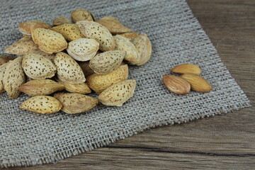 Almonds on wooden background