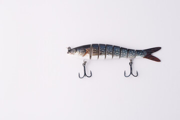 Fishing bait tackle and baubles for fishing on a white background with copie space.