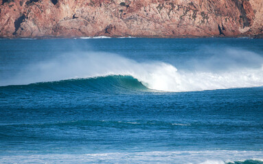 Perfect wave breaking in a beach. Surf spot