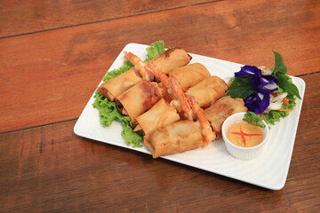 Fried Spring Rolls with shirmp and sweet sauce, Asian food snack fried roll vietnamese style or chinese style.