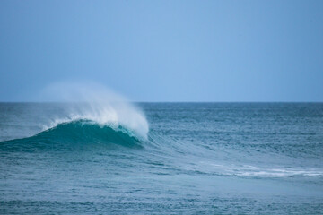Perfect wave breaking in a beach. Surf spot