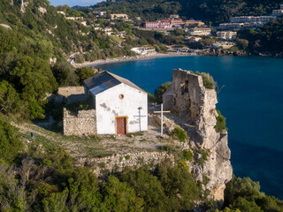 Fototapeta na wymiar Aerial drone view of Old chapel in Ermones beach