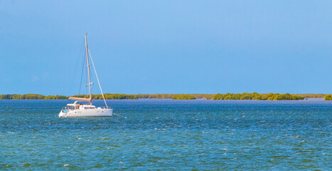 Obraz premium Panorama landscape view Holbox island turquoise water and boats Mexico.