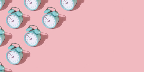 Banner from alarm clocks on a pink background.