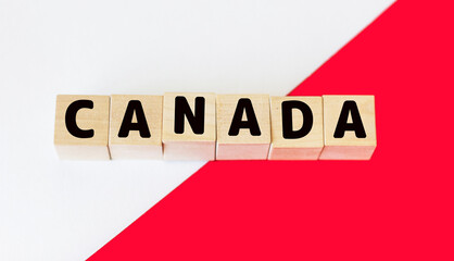 Canada word on wooden blocks and red and white background