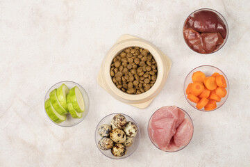 A bowl of dry pet food. Ingredients for preparing food for dogs and cats. View from above.