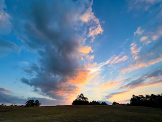 Naklejka na ściany i meble Colorful cloudy sky at sunset, beautiful nature background