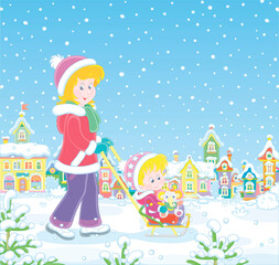 Young cute mom sledding her happy little daughter with a funny toy elephant down a snow-covered street of a pretty small town on a snowy winter day, vector cartoon illustration