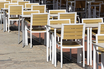 Tables of a terrace arranged in a row with safety distance