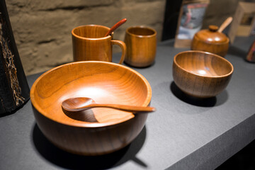Wooden tableware close up view . Wooden kitchen utensils