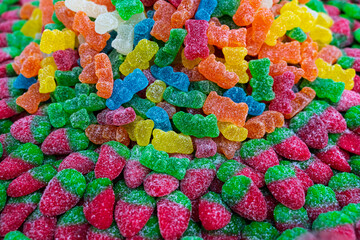 Children's marmalade sweets in the shape of strawberries and colorful bears
