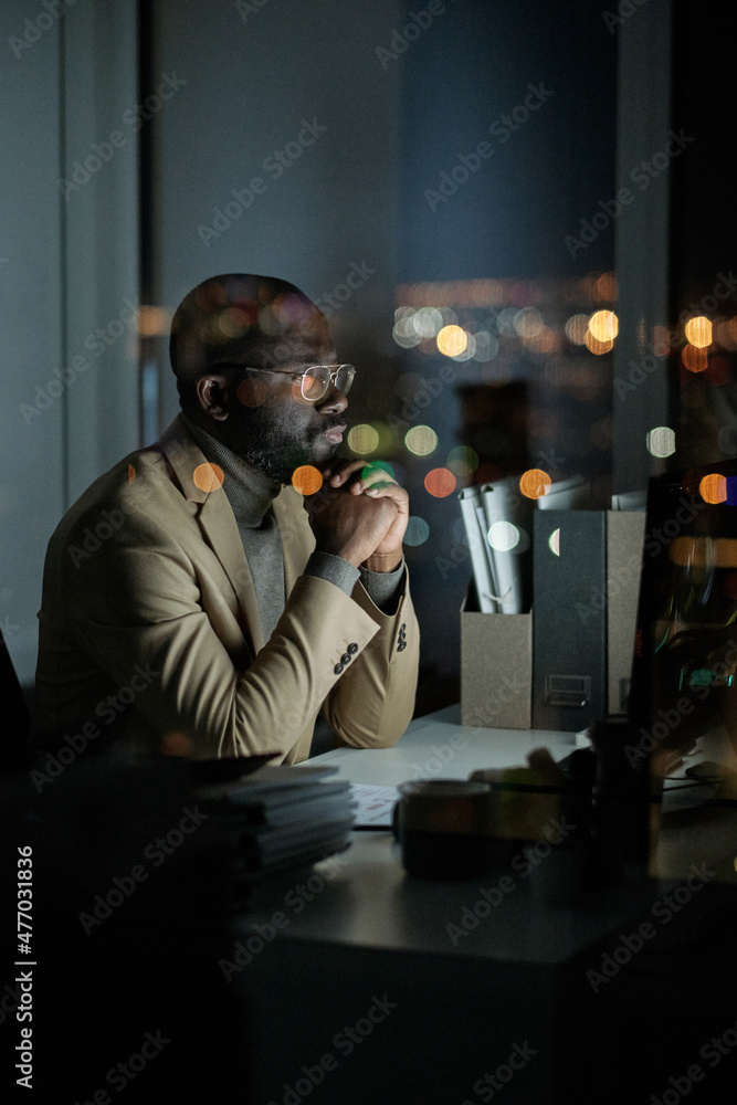 Poster contemporary manager in formalwear looking through online data on computer screen while working in o