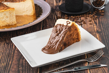 Obraz premium San Sebastian Cheesecake with Chocolate Poured on it
