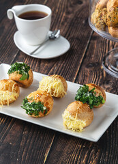 Turkish pastry filled with dill, parsley, cream cheese and cheddar cheese. Turkish name: Sakallı Pogaca or Saçaklı Pogaca