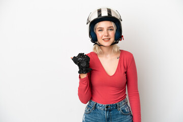 Young caucasian woman with a motorcycle helmet isolated on white background pointing to the side to present a product