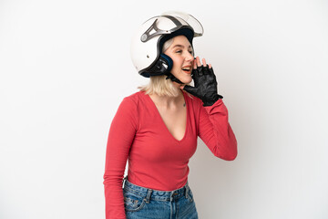 Young caucasian woman with a motorcycle helmet isolated on white background shouting with mouth wide open to the side
