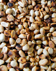 A roasted peanuts on a surface