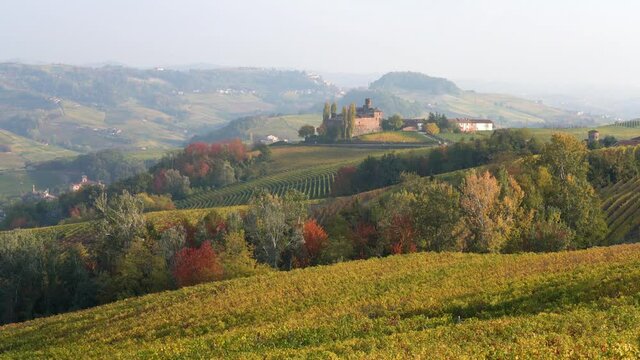 Beautiful autumnal landscape with the Castello della Volta, in the langhe region of Piedmont, Italy.