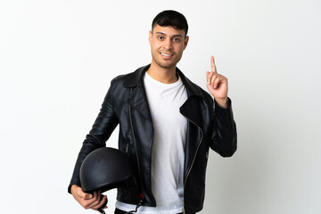 Man with a motorcycle helmet isolated on white background showing and lifting a finger in sign of...