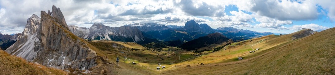 Fototapeta na wymiar Hiking Dolomites in European Alps. Shot in summer with green grass and no snow. Gardena Pass, Italy