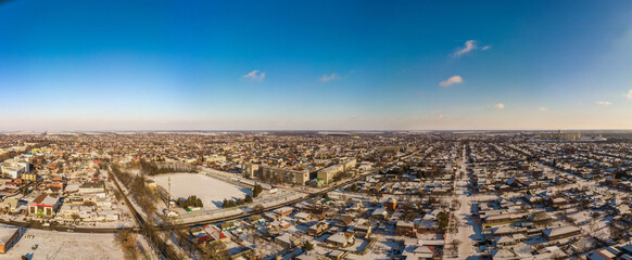 winter panoramic landscape of Korenovsk city  (South of Russia) - snow-covered courtyards and low-rise buildings