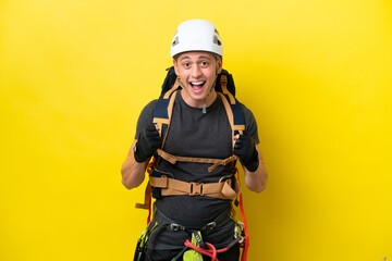 Young rock climber Brazilian man celebrating a victory in winner position