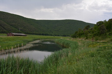 Fototapeta na wymiar Landscape with river and hills